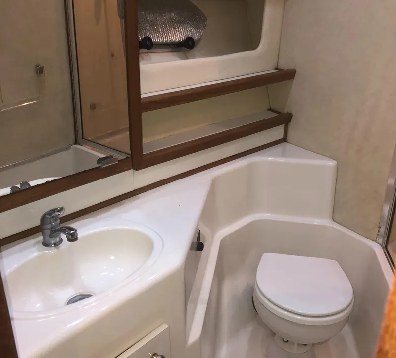 Slide: The Image of Bathroom interior of 1996 Bayliner 4788 Pilot House Motoryacht with sink and toilet. - 31