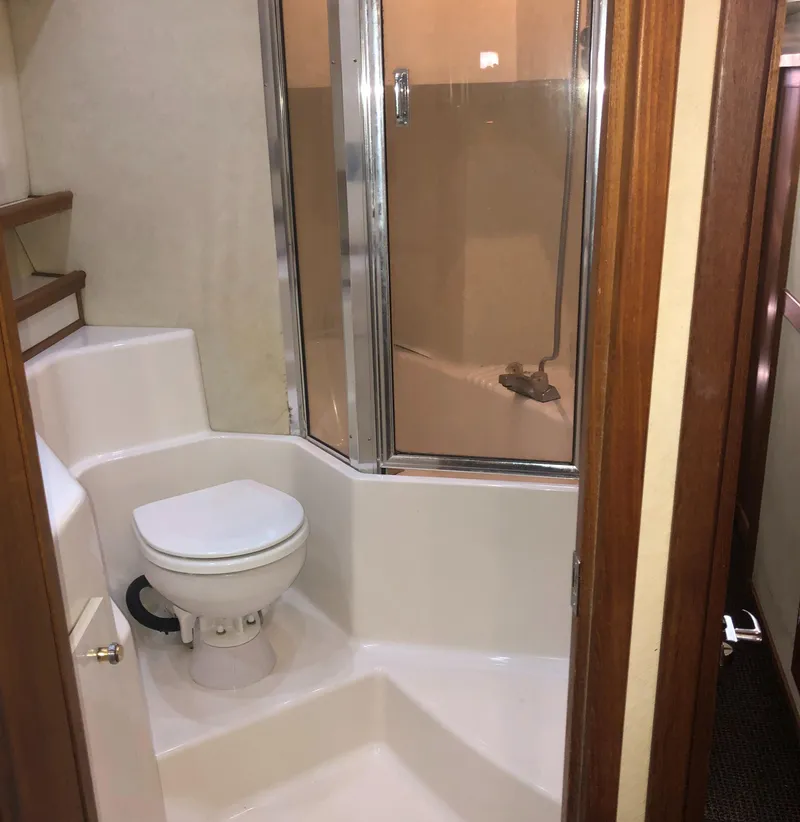 Slide: The Image of 1996 Bayliner 4788 Pilot House Motoryacht bathroom with shower and toilet. - 33