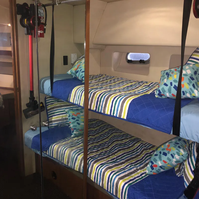 Slide: The Image of Bunk beds in 1996 Bayliner 4788 Pilot House Motoryacht cabin with colorful bedding. - 34