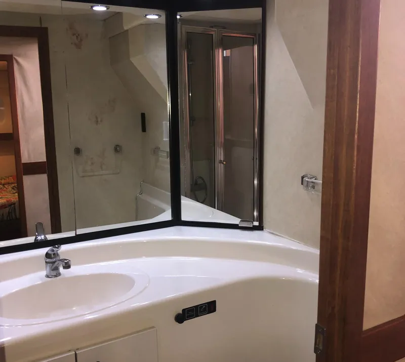 Slide: The Image of Bathroom interior of 1996 Bayliner 4788 Pilot House Motoryacht with sink and mirror. - 37