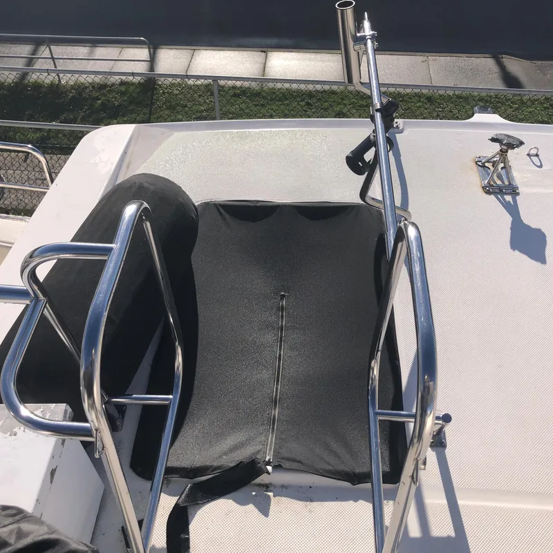 Slide: The Image of 1996 Bayliner 4788 Pilot House Motoryacht deck with railing and fishing rod holder. - 43