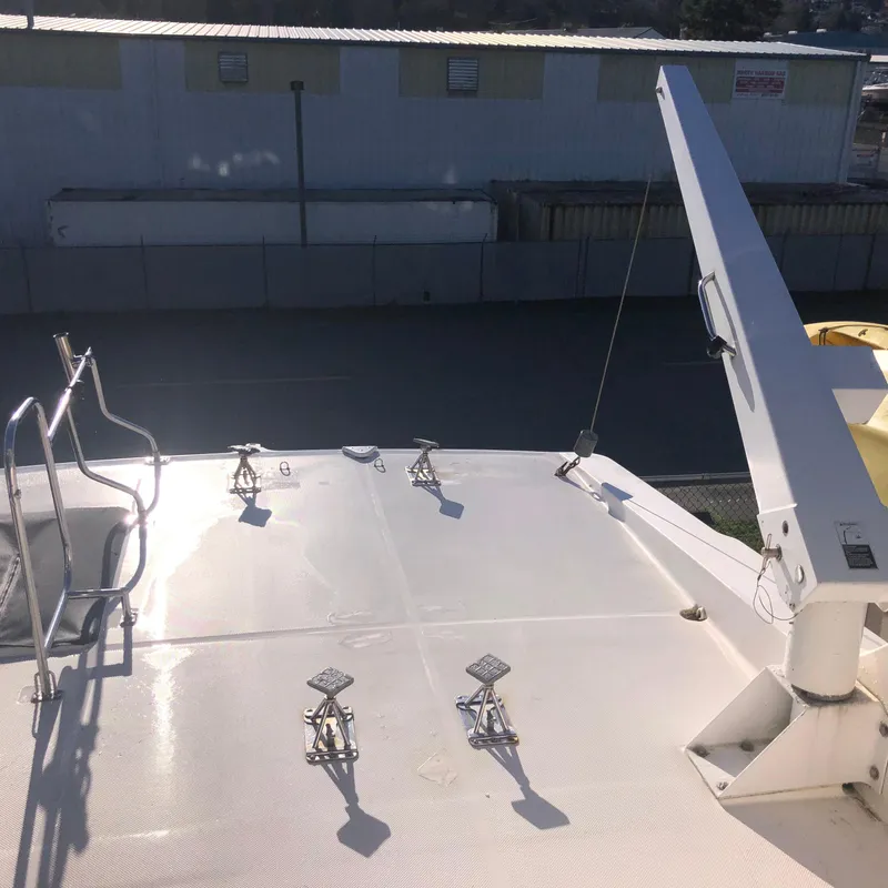 Slide: The Image of Rooftop view of 1996 Bayliner 4788 Pilot House Motoryacht with crane and railings. - 44