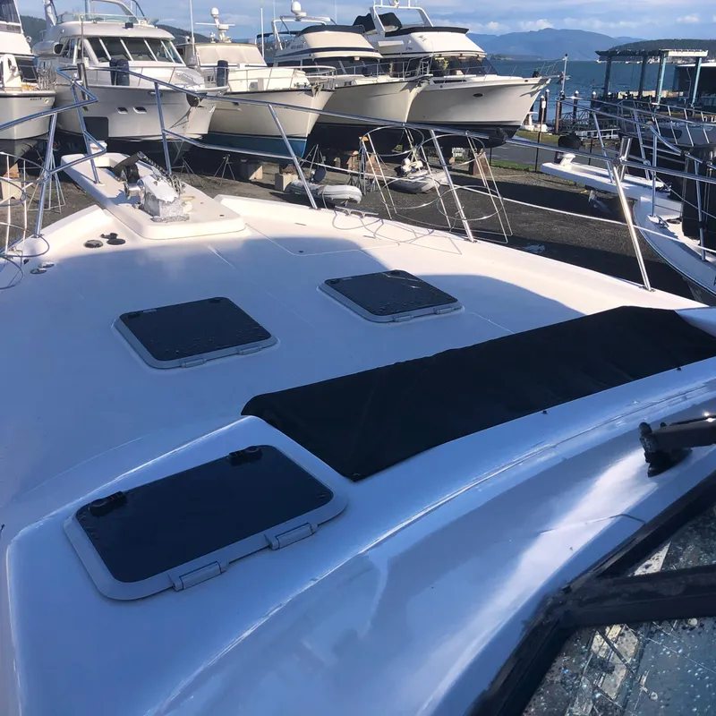 Slide: The Image of 1996 Bayliner 4788 Pilot House Motoryacht on display at a marina. - 45