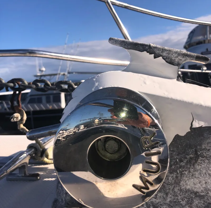 Slide: The Image of Close-up of a 1996 Bayliner 4788 yacht's anchor winch with "Muir" branding. - 48