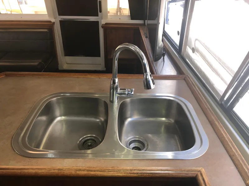 Slide: The Image of Stainless steel double sink in 1996 Bayliner 4788 Pilot House Motoryacht kitchen area. - 8