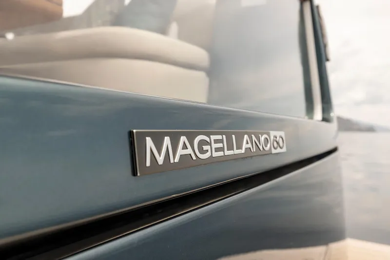 Slide: The Image of Close-up of 2025 Azimut Magellano 60 yacht nameplate on sleek exterior. - 10