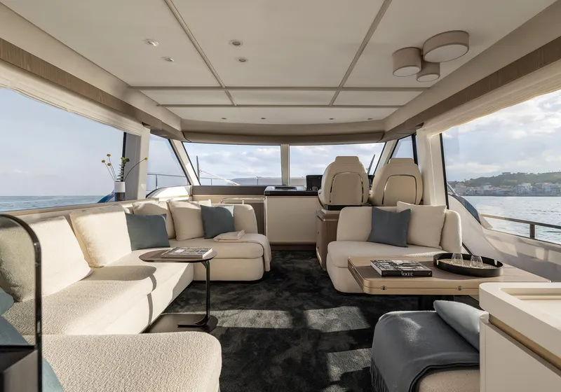 Slide: The Image of Luxurious interior of 2025 Azimut Magellano 60 yacht with elegant seating and panoramic windows. - 13