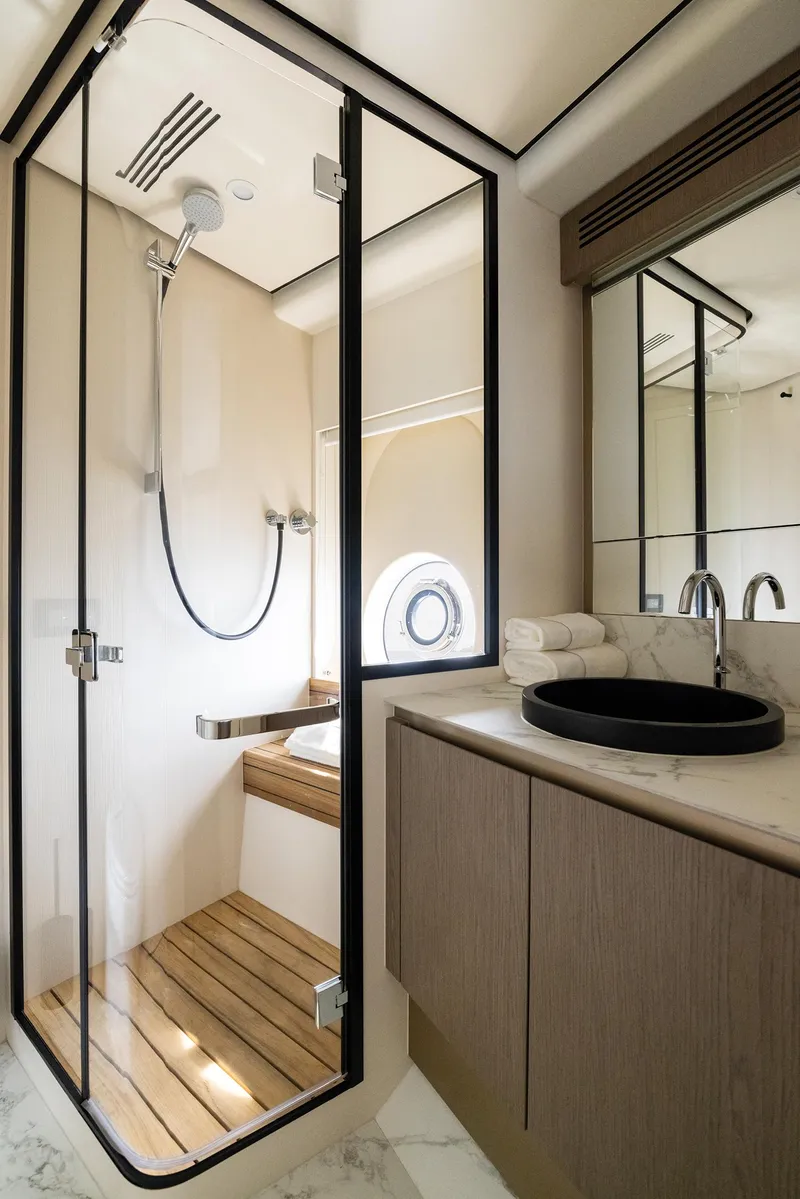 Slide: The Image of Luxurious bathroom in 2025 Azimut Magellano 60 yacht with modern shower and sleek design. - 19