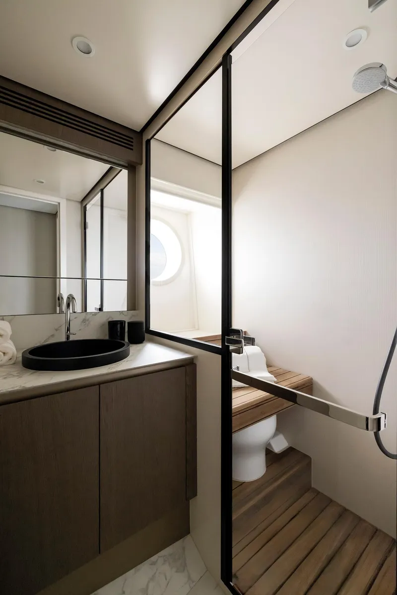 Slide: The Image of Luxurious bathroom in 2025 Azimut Magellano 60 yacht with modern fixtures and elegant design. - 23