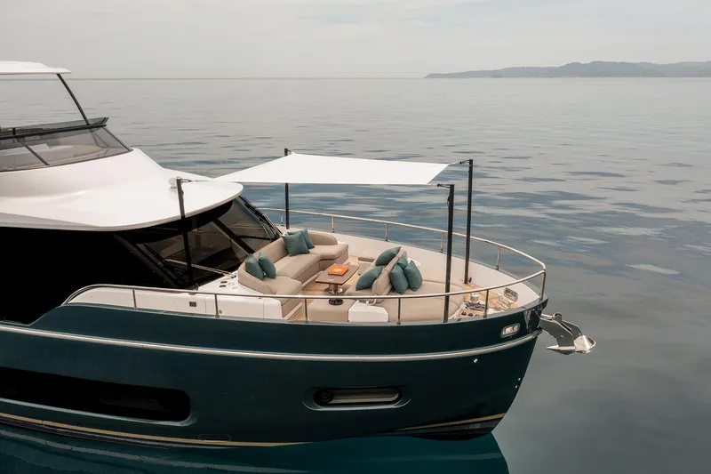 Slide: The Image of Azimut Magellano 60 yacht, 2025 model, featuring a luxurious deck with seating and canopy. - 48
