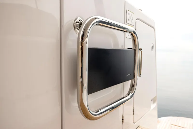 Slide: The Image of Azimut Magellano 60 yacht detail, 2025 model, featuring sleek chrome handle design. - 50