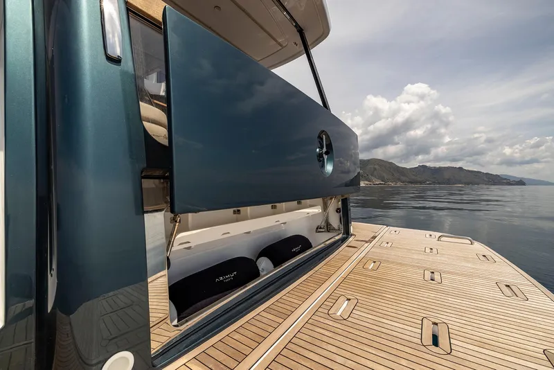 Slide: The Image of 2025 Azimut Magellano 60 yacht with open deck, scenic ocean view. - 51
