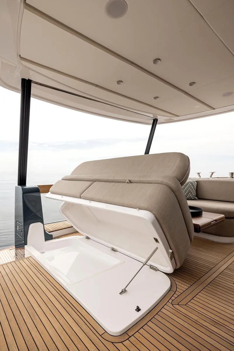 Slide: The Image of 2025 Azimut Magellano 60 yacht interior with open storage compartment on deck. - 9