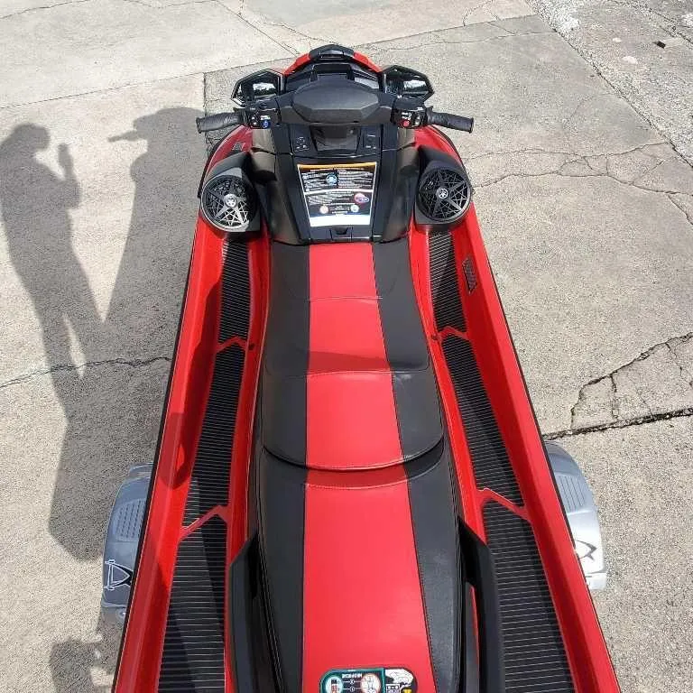 Slide: The Image of 2025 Yamaha WaveRunner VX Deluxe in red and black, parked on concrete. - 1