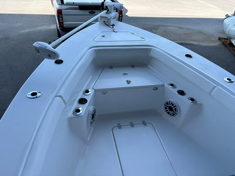 Slide: The Image of 2025 Clark Sound 24 boat interior with storage compartments and cup holders. - 12