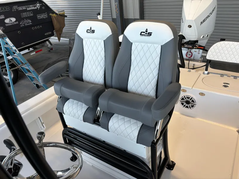 Slide: The Image of Luxury seating on 2025 Clark Sound 24 boat with quilted upholstery. - 13