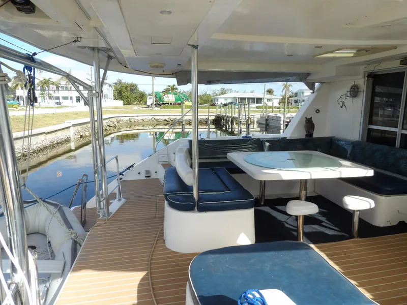 Slide: The Image of Spacious deck of 2014 Leopard 48 yacht with seating and dining area. - 15
