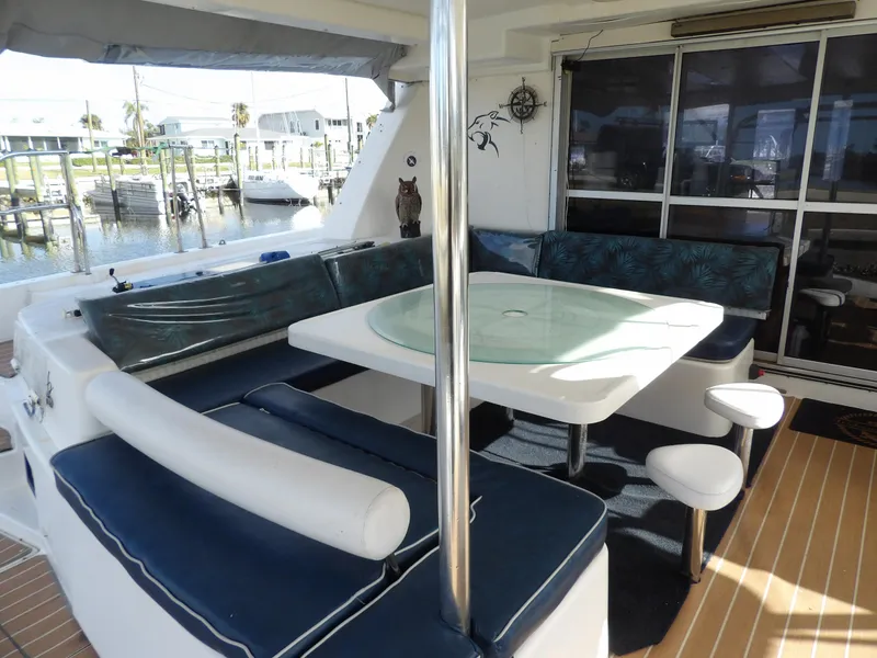 Slide: The Image of Leopard 48 yacht interior with seating area and table, 2014 model. - 16