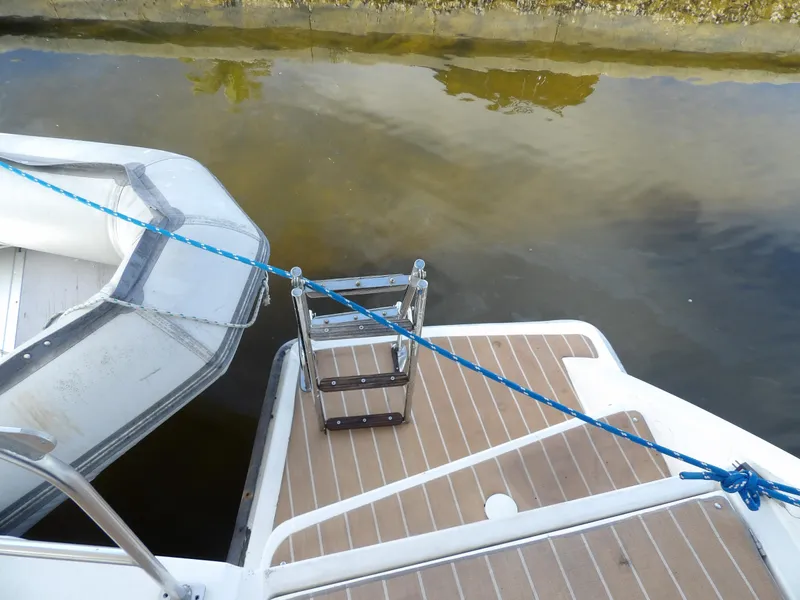 Slide: The Image of Leopard 48 yacht stern with ladder and moored dinghy, 2014 model. - 20