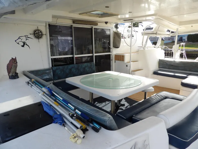 Slide: The Image of Spacious Leopard 48 yacht deck with seating, table, and fishing gear, 2014 model. - 22