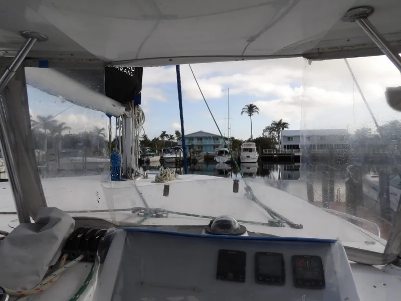 Slide: The Image of View from Leopard 48 yacht cockpit, overlooking marina with palm trees and boats, 2014 model. - 29
