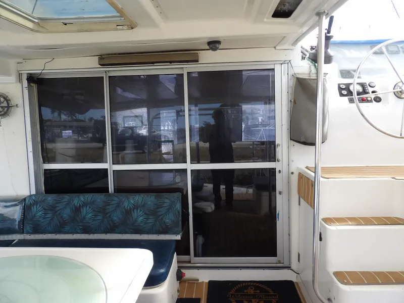 Slide: The Image of Interior view of a 2014 Leopard 48 yacht with seating and stairs. - 46