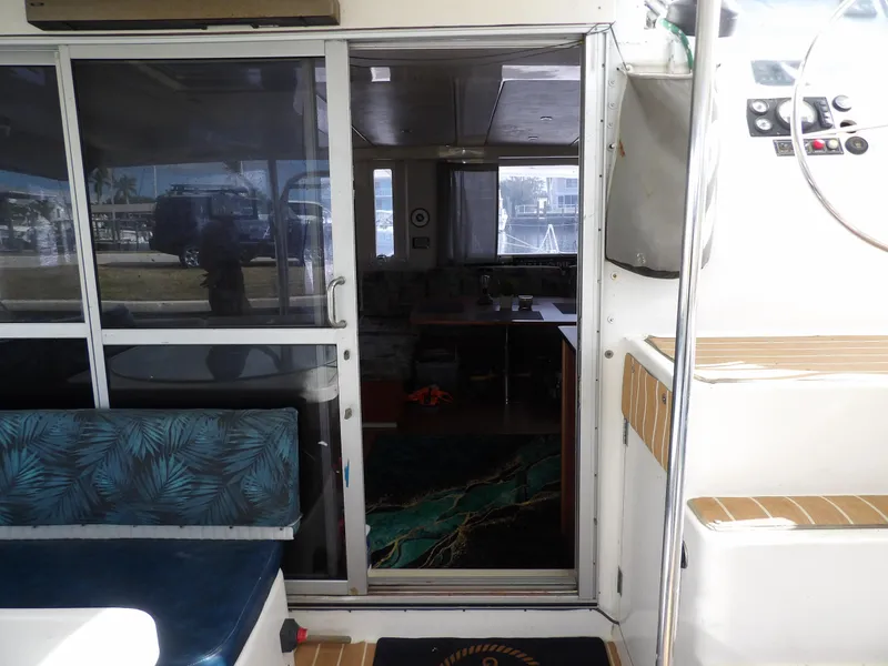 Slide: The Image of Interior view of 2014 Leopard 48 yacht with sliding glass door and seating area. - 47