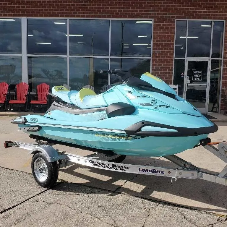 Slide: The Image of 2025 Yamaha WaveRunner VX Limited Ho on trailer outside a store. - 4