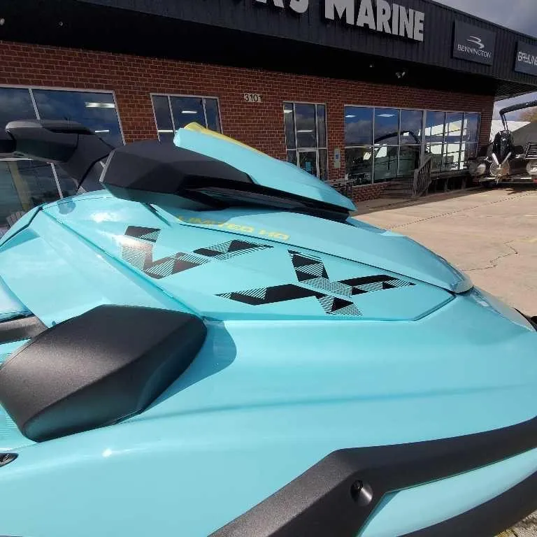 Slide: The Image of 2025 Yamaha WaveRunner VX Limited Ho in vibrant blue at a marine dealership. - 6