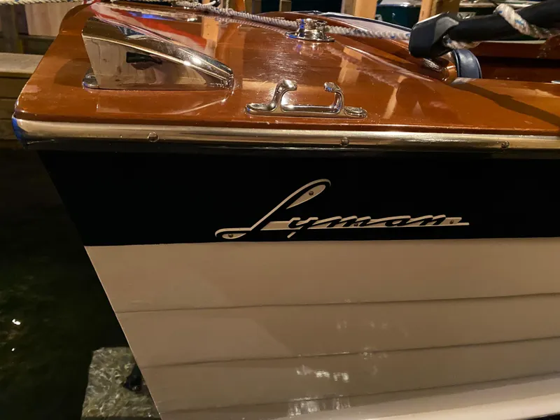 Slide: The Image of 1962 Lyman 24 Sleeper Hardtop boat with polished wood and chrome details. - 20
