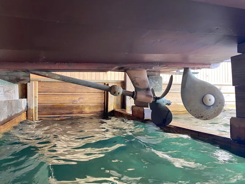 Slide: The Image of Underwater view of 1962 Lyman 24 Sleeper Hardtop boat propeller and rudder. - 30