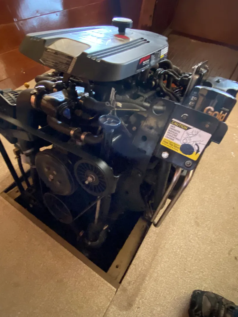 Slide: The Image of 1962 Lyman 24 Sleeper Hardtop engine, detailed view in boat interior. - 35