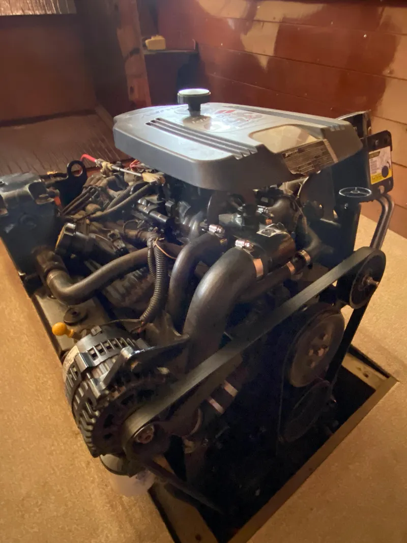 Slide: The Image of 1962 Lyman 24 Sleeper Hardtop engine in a wooden interior setting. - 36