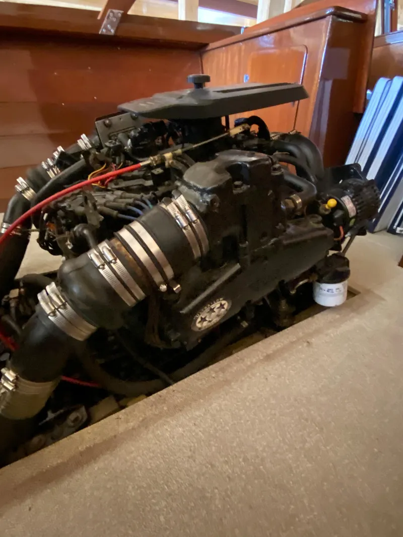 Slide: The Image of 1962 Lyman 24 Sleeper Hardtop engine, detailed view of mechanical components and hoses. - 37