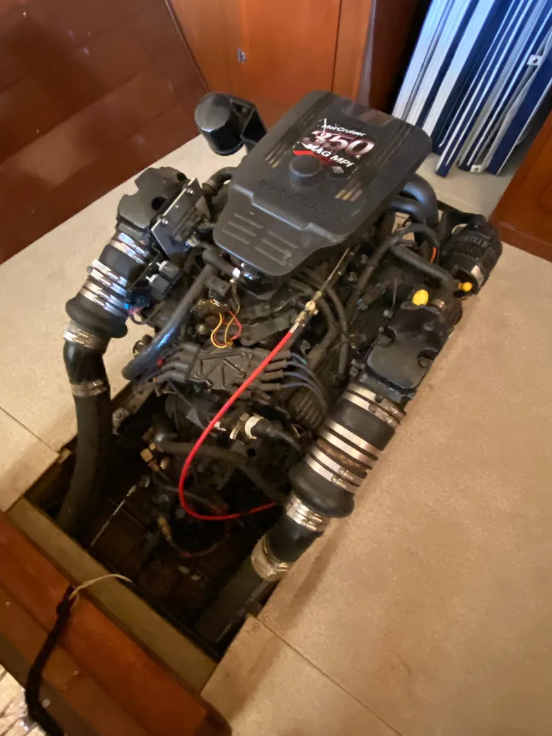 Slide: The Image of Engine of a 1962 Lyman 24 Sleeper Hardtop boat, showcasing intricate mechanical details. - 38