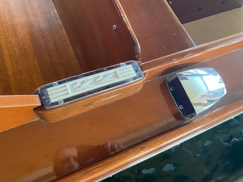Slide: The Image of 1962 Lyman 24 Sleeper Hardtop boat detail with polished wood and chrome accents. - 8