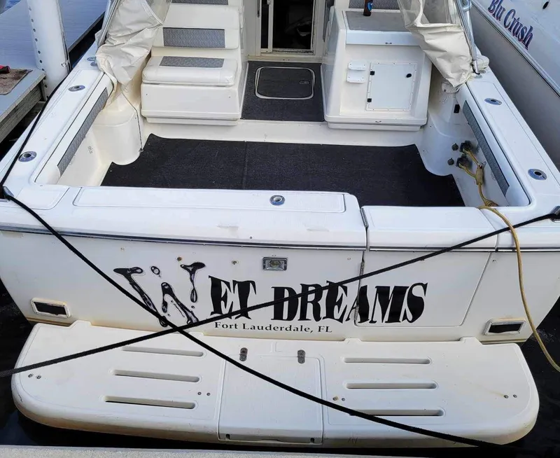 Slide: The Image of 1995 Tiara Yachts 3100 Open boat named "Wet Dreams" docked in Fort Lauderdale. - 6
