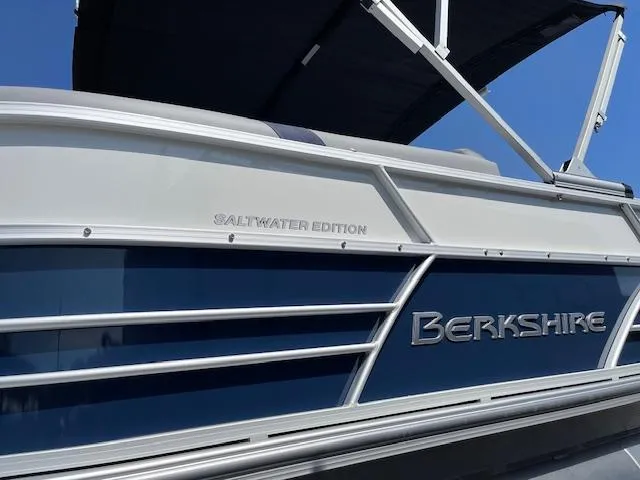Slide: The Image of 2025 Berkshire 24RFX CTS3 Saltwater Edition pontoon boat, blue and white exterior. - 14