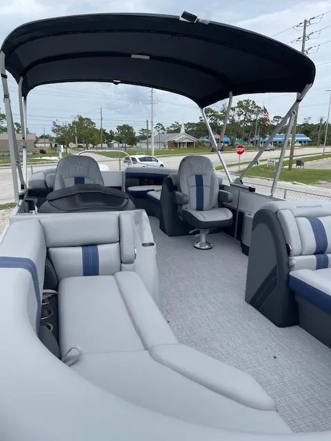Slide: The Image of 2025 Berkshire 24RFX CTS3 pontoon boat with spacious seating and canopy. - 15
