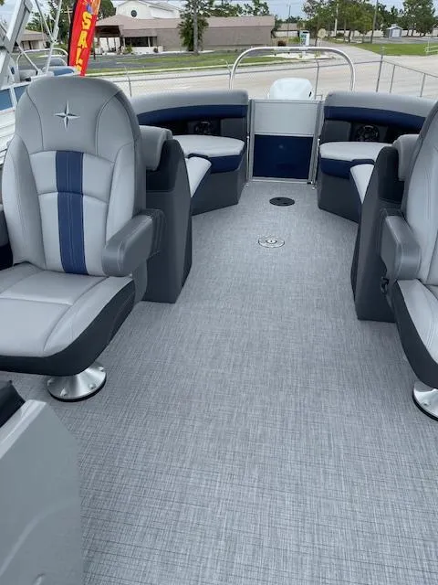 Slide: The Image of 2025 Berkshire 24RFX CTS3 pontoon boat interior with gray and blue seating. - 16