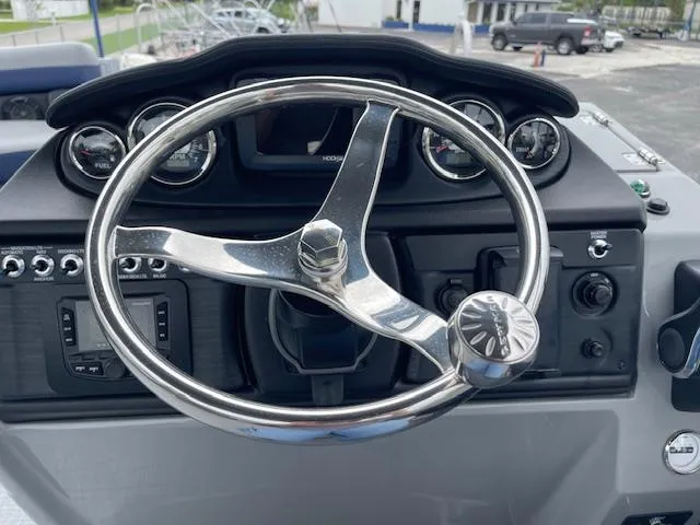 Slide: The Image of Steering wheel and dashboard of 2025 Berkshire 24RFX CTS3 boat. - 19