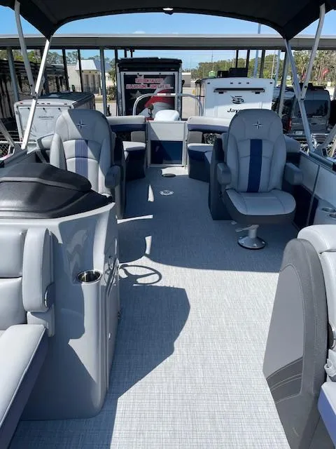 Slide: The Image of 2025 Berkshire 24RFX CTS3 pontoon boat interior with gray seating and canopy. - 3