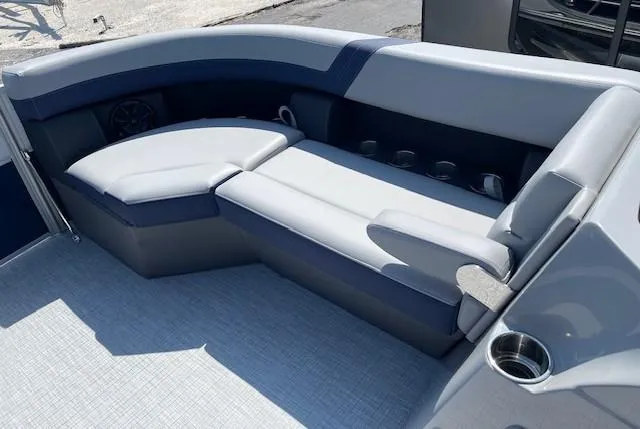 Slide: The Image of 2025 Berkshire 24RFX CTS3 boat interior with gray seating and cup holders. - 4