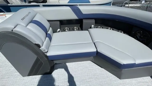 Slide: The Image of 2025 Berkshire 24RFX CTS3 boat seating with gray and blue upholstery. - 5