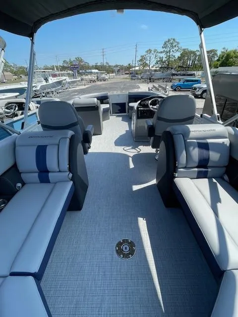 Slide: The Image of 2025 Berkshire 24RFX CTS3 pontoon boat interior with plush seating and modern design. - 9