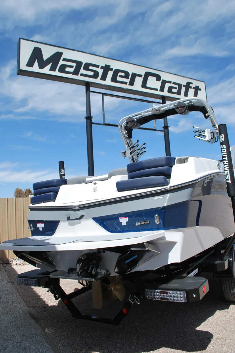 Slide: The Image of 2024 MasterCraft XT24 boat displayed under MasterCraft sign. - 12