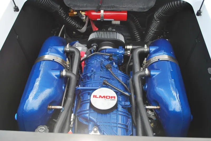 Slide: The Image of 2024 MasterCraft XT24 engine with blue Ilmor components. - 13