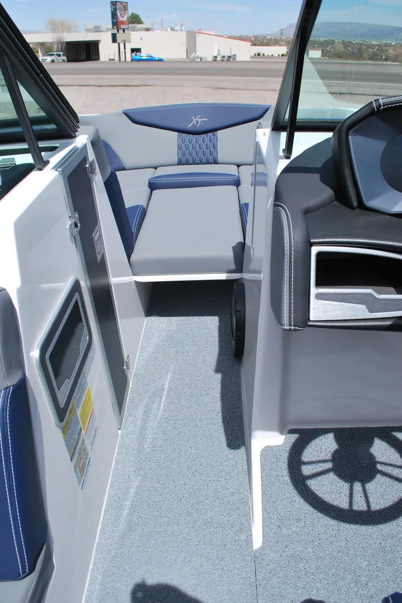 Slide: The Image of 2024 MasterCraft XT24 boat interior with modern seating and steering wheel. - 5