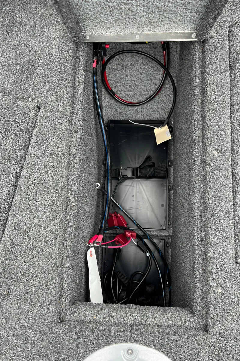 Slide: The Image of Battery compartment of 2025 Lund 1975 Tyee boat with wiring and cables. - 11