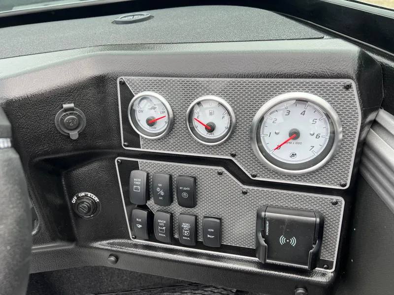 Slide: The Image of Dashboard of 2025 Lund 1975 Tyee boat with gauges and control switches. - 22